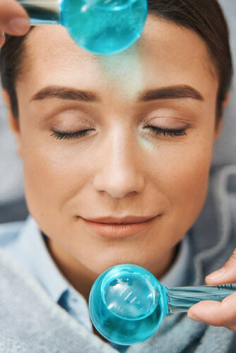 Cooling ice globes on the face